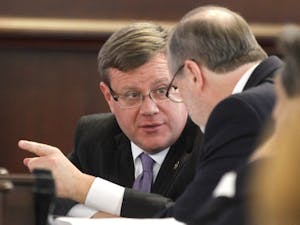 North Carolina Speaker of the House Tim Moore, left, confers with President Pro Tempore Phil Berger in the Senate chambers during a special session of the North Carolina General Assembly on Friday, Dec. 16, 2016 at the Legislative Building in Raleigh, N.C. (Ethan Hyman/Raleigh News & Observer/TNS)
