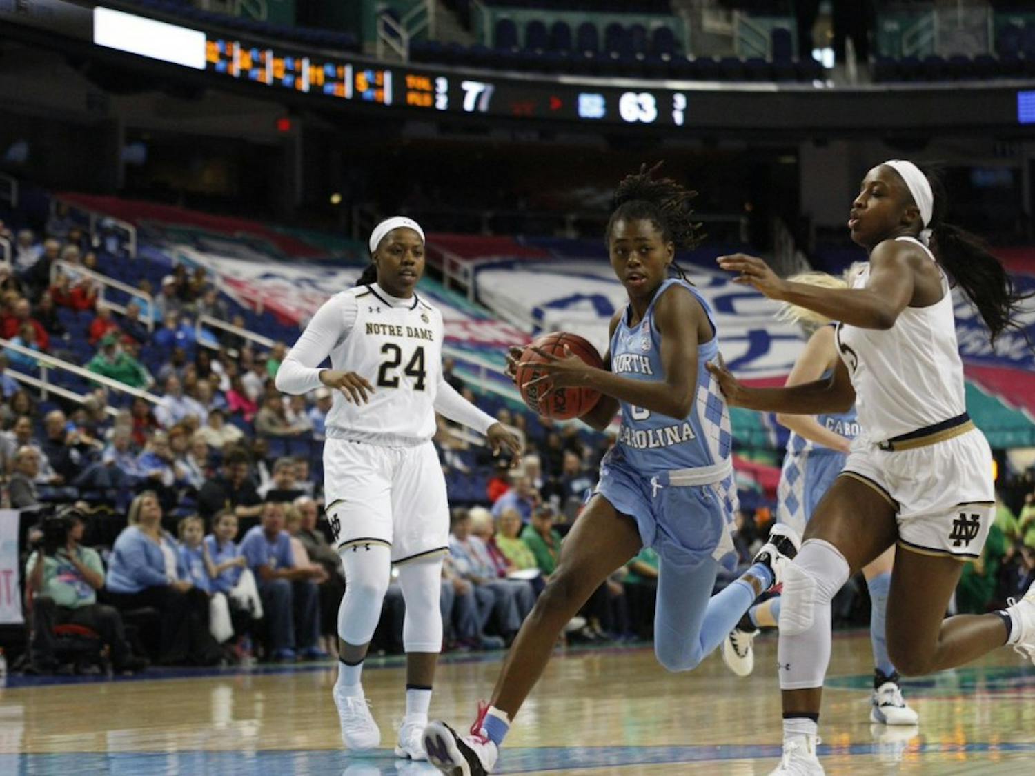 North Carolina junior guard Shayla Bennett drives past Notre Dame's Jackie Young in an ACC Tournament second-round matchup on March 8, 2019.