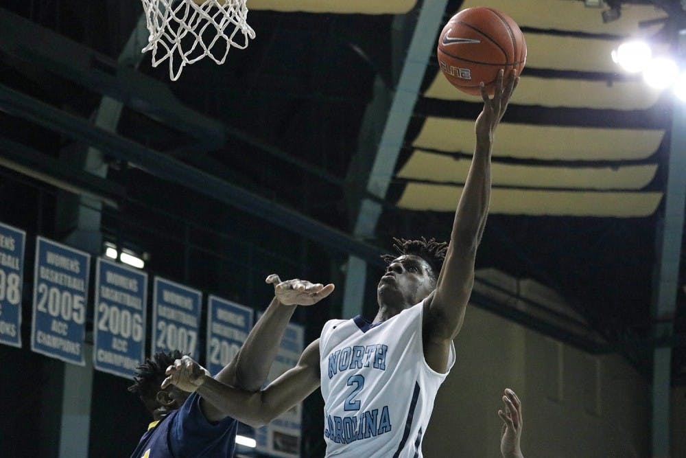 North Carolina guard Robby Wuo (2) goes for a layup against Northwood Temple Academy. The Tar Heels defeated Northwood Temple Academy 101-69.