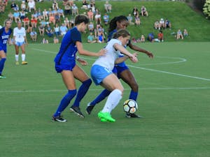 Jessie Scarpa (12) defends the ball against Duke players on Friday at WakeMed Soccer Park in Cary, N.C.