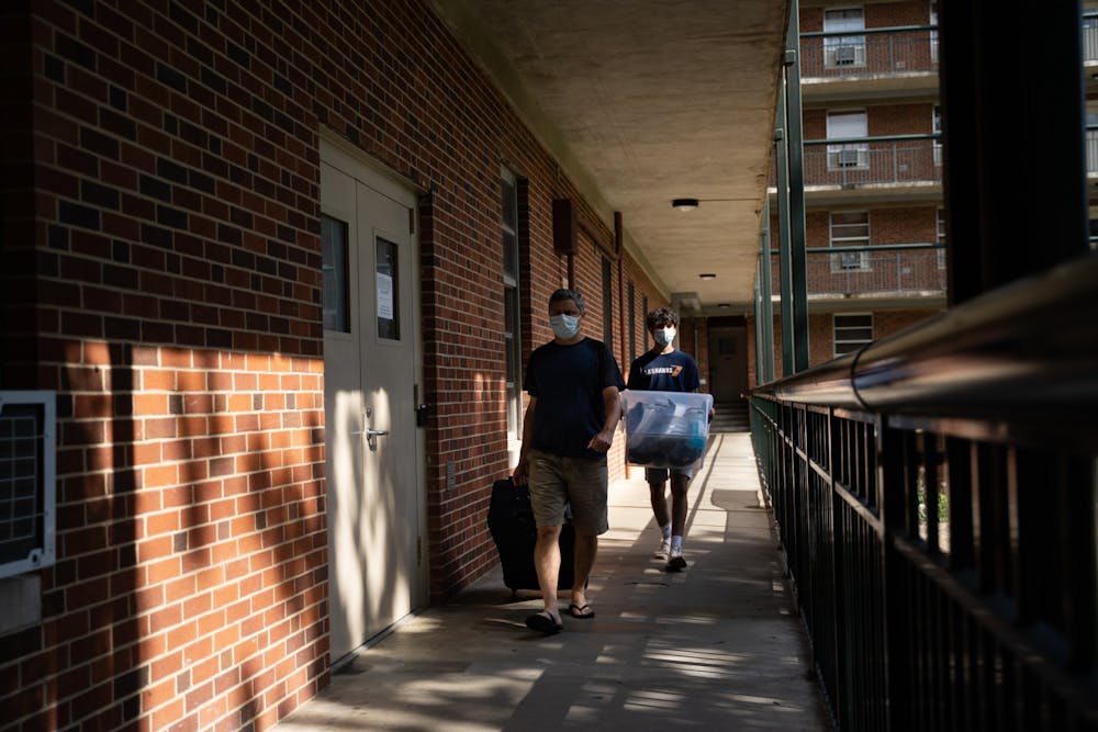 A first-year previously living in Craige Residence Hall moves out with the help of his dad on Tuesday, Aug. 18, 2020 following UNC’s announcement that all classes will be moving to an online format.
