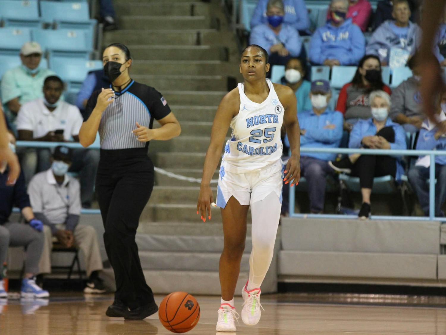 Sophomore Deja Kelly takes the ball down the court against James Madison University on Dec. 5, 2021. The Tar Heels won 93-47.