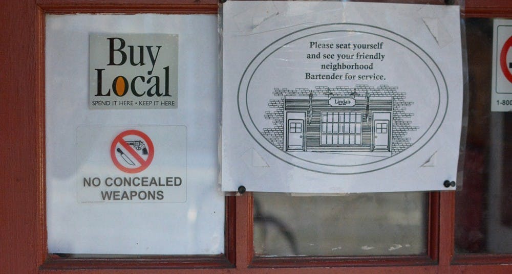 Linda's is one of several Chapel Hill businesses that has a no concealed weapons decal posted outside of its window.