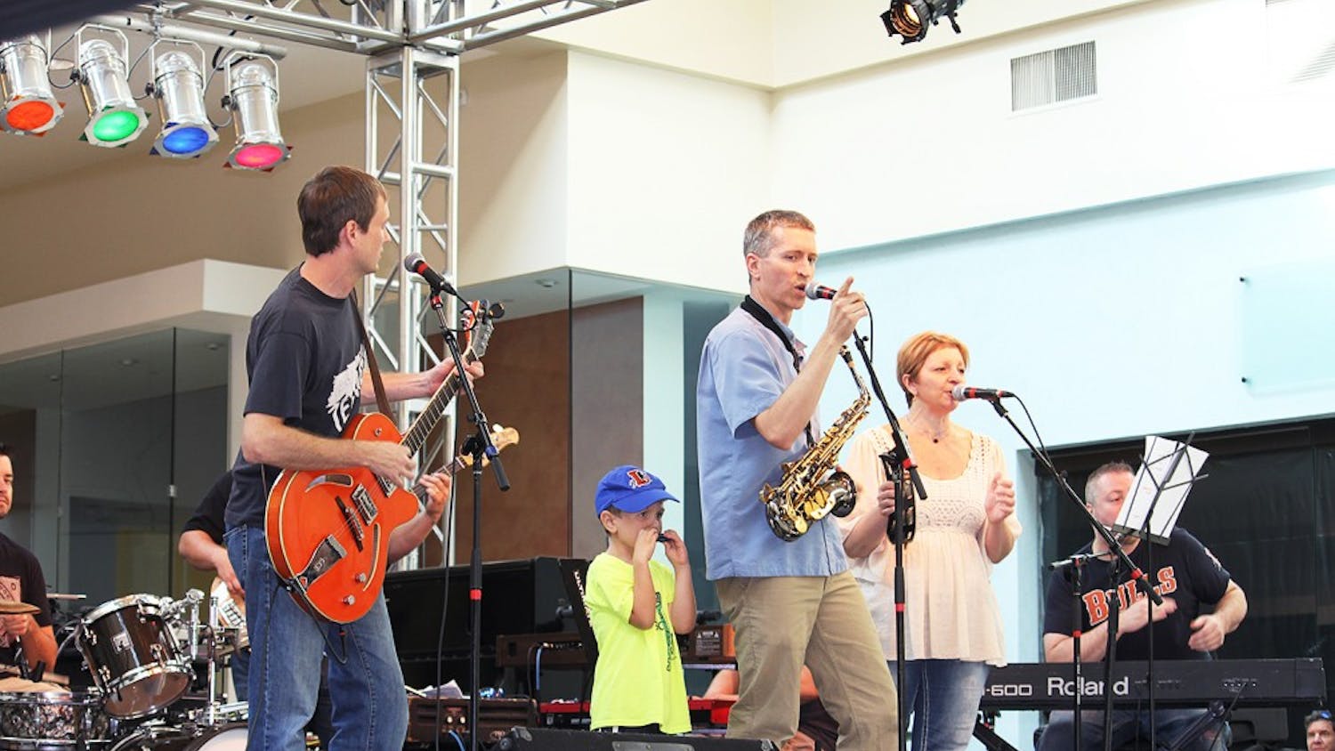 The Buzztown Band performs at the Not So Normal 5K at University Mall on Sunday.