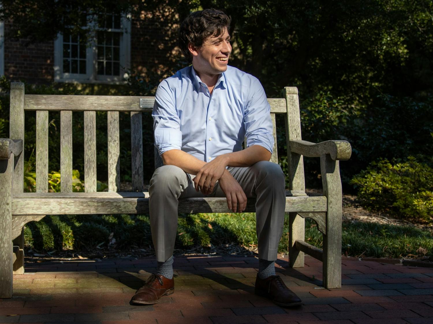 Jonah Garson is running for the N.C. House seat that will be open after Rep. Verla Insko retires at the end of her term in December 2022. Garson poses for a portrait Monday in the Wellstone Memorial Garden on UNC's campus, named for political organizers that Garson said he looks up to. "They were rockstars for left labor policies," Garson said.