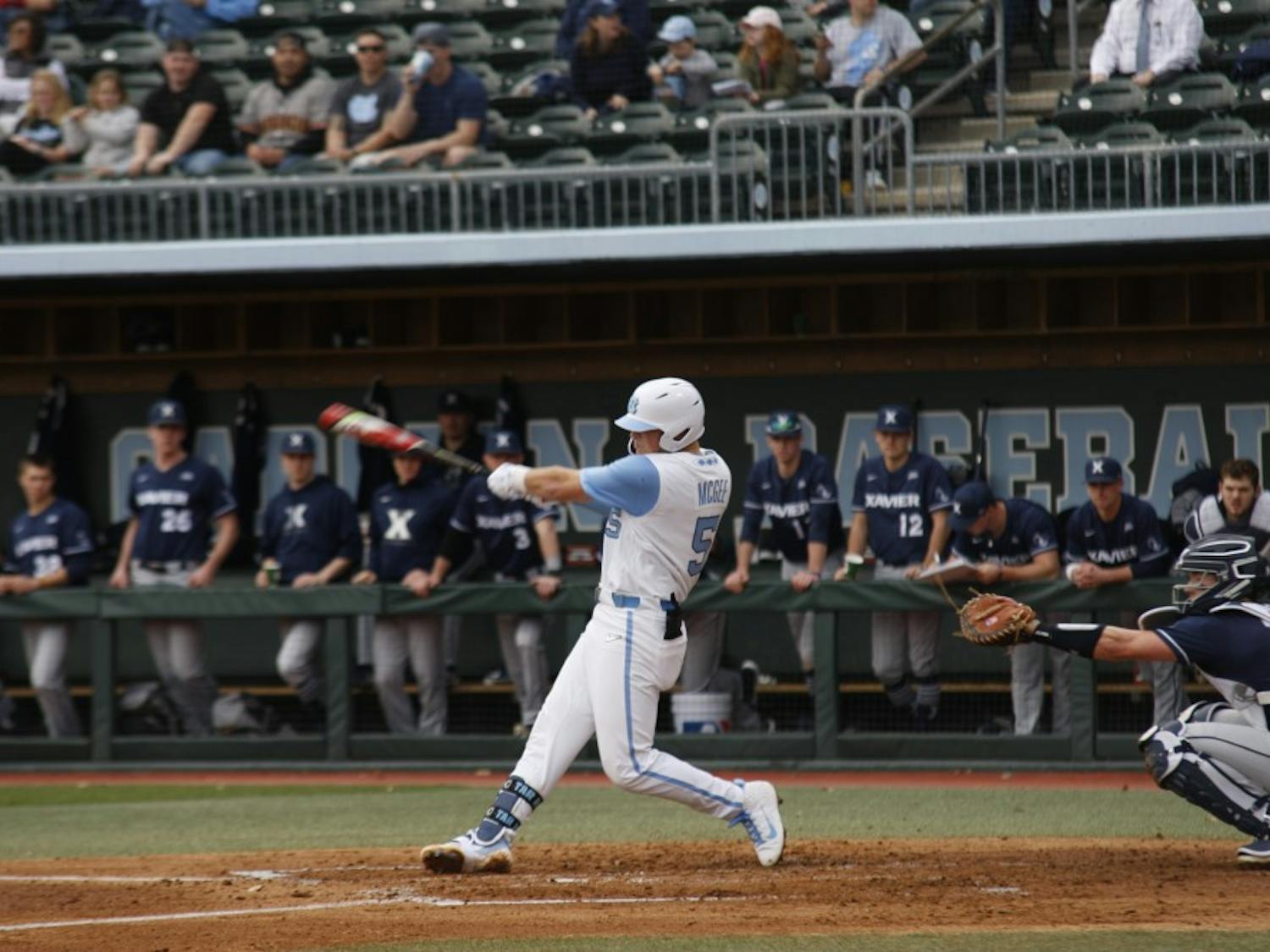 Junior second baseman Ashton McGee (5) swings sharp and fast at the ball during UNC's 12-3 win against Xavier on Friday, Feb. 15, 2019. 
