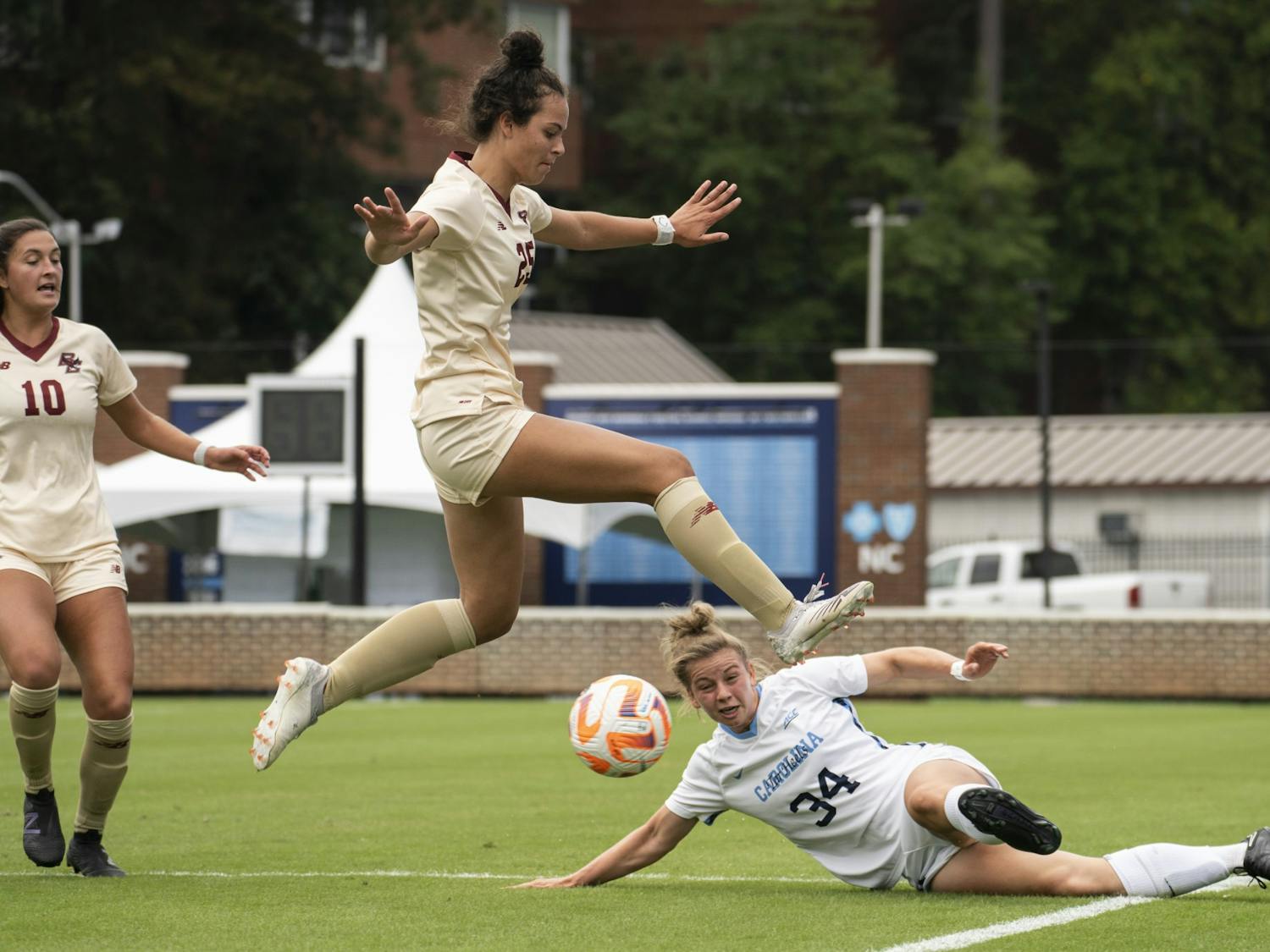Boston College Sophia Lowenberg, first-year middle, leaps for the ball as UNC Tessa Dellarose, first-year defender/forward, kicks it under her at the Women’s Soccer game at Dorrance Field on Sunday, Sept. 25, 2022.