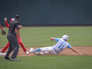 UNC sophomore outfielder/catcher Caleb Roberts (11) attempts to slide into second base during the Tar Heels' 1-6 loss against N.C. State on Saturday, March 27, 2021 in Boshamer Stadium in Chapel Hill, N.C.