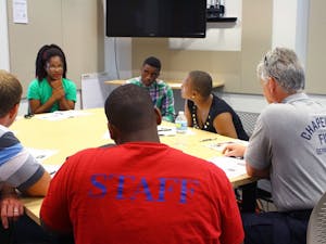 (Far left) Hargraves Community Center counselor Jazmine Mason-Carter brainstorms safety ideas with other trainees.