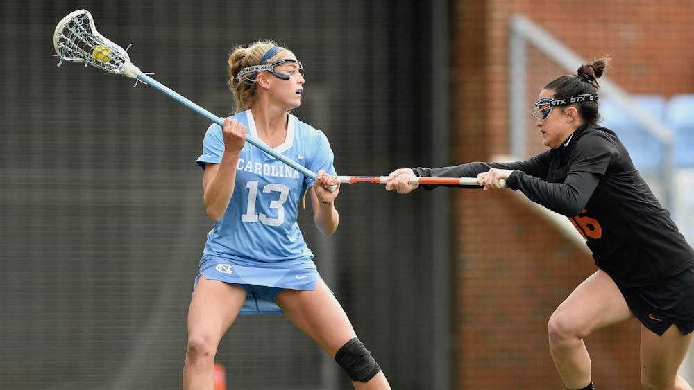 <p>UNC's Caitlyn Wurzburger (13) looks to pass the ball during a game against Florida at Dorrance Field on Friday, February 19, 2021. Photo courtesy of Dana Gentry.</p>