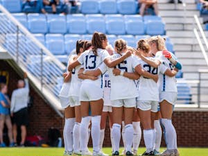 The UNC women’s soccer team huddles before the game against the University of Central Florida on Sunday, Sept. 11, 2022, at Dorrance Field.