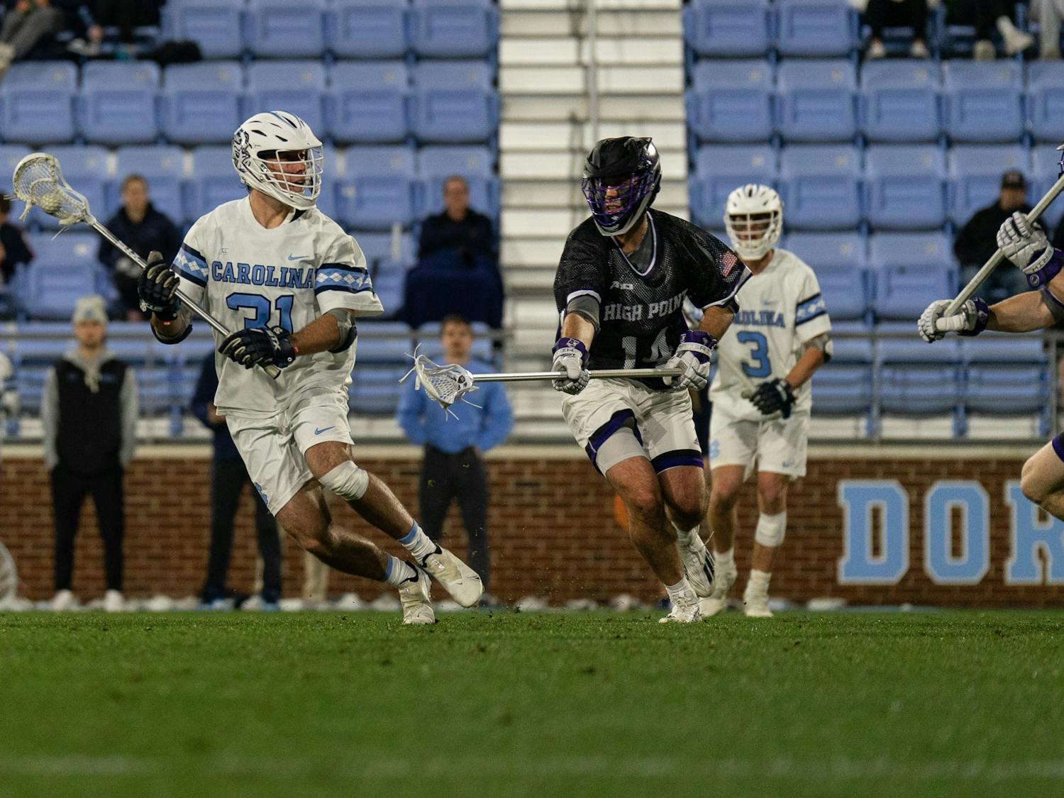 UNC graduate midfielder Connor Maher (31) looks to throw the ball during the men's lacrosse game against High Point on Wednesday, March 22, 2023, at Dorrance Field. UNC beat High Point 16-9.