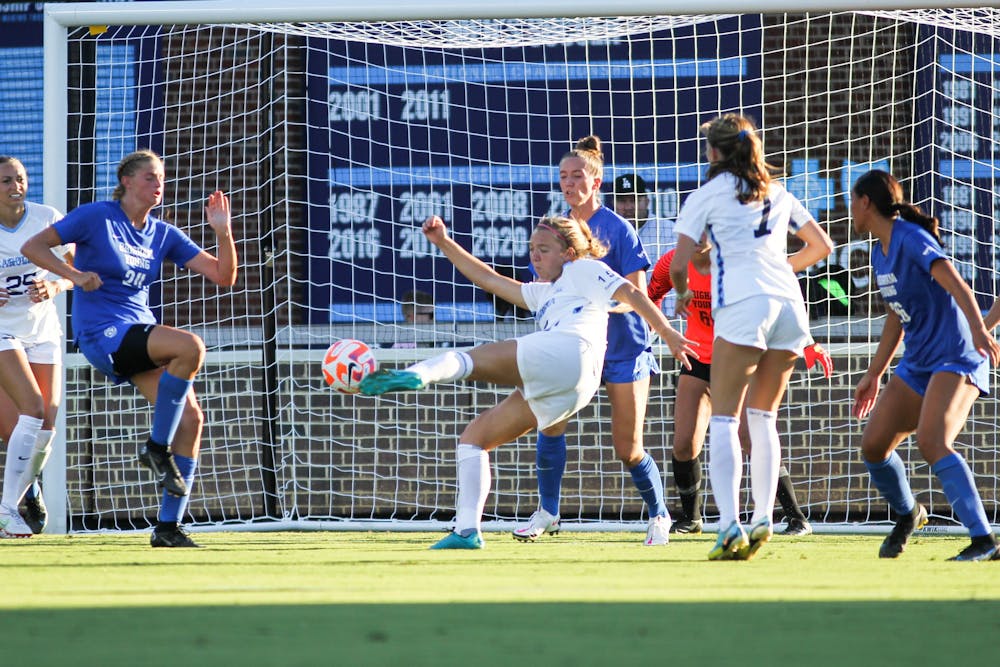 Junior defender/midfielder Avery Patterson (15) scores a goal during UNC's second exhibition game against BYU at Dorrance Field on Saturday, Aug. 13, 2022. UNC won 2-0