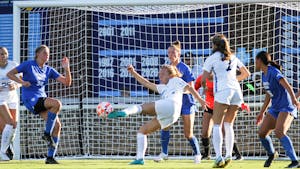 Junior defender/midfielder Avery Patterson (15) scores a goal during UNC's second exhibition game against BYU at Dorrance Field on Saturday, Aug. 13, 2022. UNC won 2-0