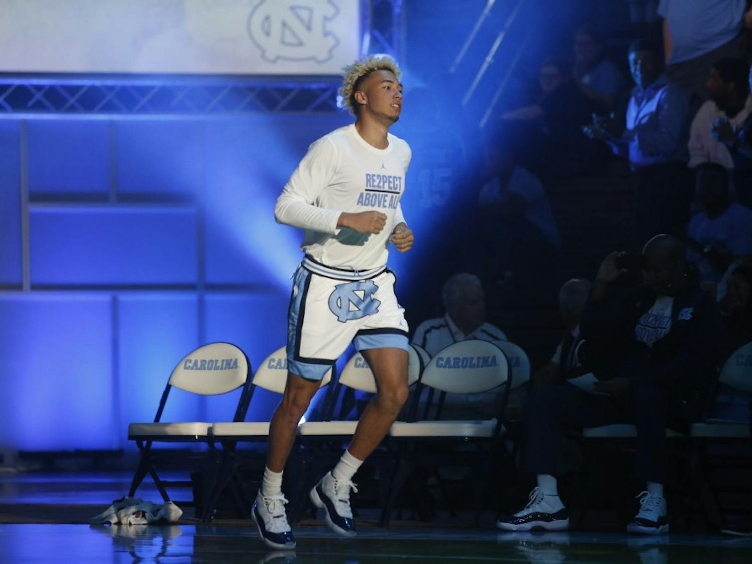 UNC forward Shea Rush (11) runs onto the court during player presentations at Late Night With Roy on Oct. 13, 2017.&nbsp;
