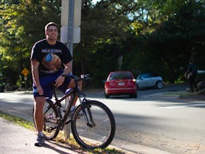 Sophomore math major Patrick Sasser keeps cool as he bikes in the Chapel Hill on Oct. 22, 2018.