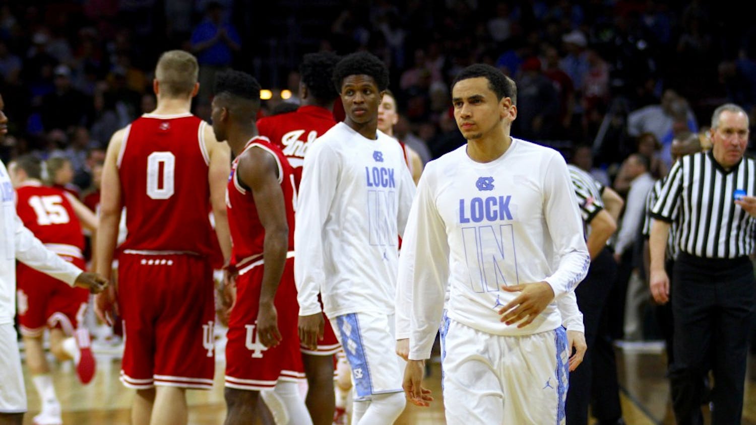 Marcus Paige warms up with the team before the start of the second half.