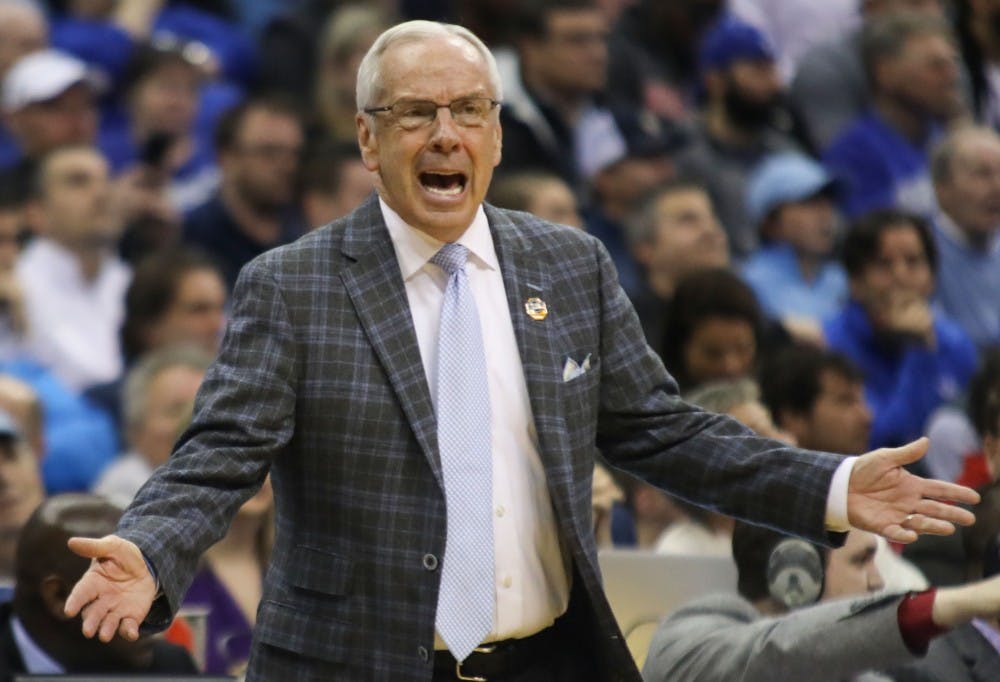 Head Coach Roy Williams yells to players and referees during UNC's 97-80 loss against Auburn in the Sweet 16 of the NCAA Tournament on Friday, March 29, 2019 at the Sprint Center in Kansas City, M.O.
