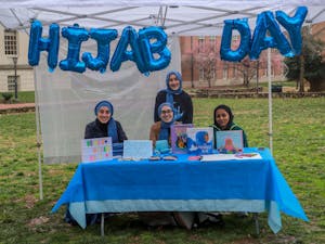 UNC senior computer science major Rida Bayraktar, first-year neuroscience major Mina Bayraktar first-year Huss Kamal, and Alyse Bayraktar, 13 years old from Cary, are pictured on National Hijab Day on Feb. 1, 2023.