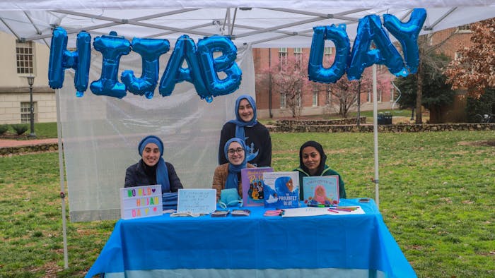 UNC senior computer science major Rida Bayraktar, first-year neuroscience major Mina Bayraktar first-year Huss Kamal, and Alyse Bayraktar, 13 years old from Cary, are pictured on National Hijab Day on Feb. 1, 2023.