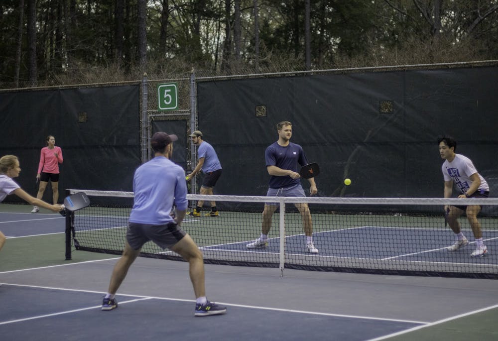 <p>Chapel Hill community members playing pickleball at Ephesus Park in Chapel Hill, N.C., Tuesday, Mar. 28, 2023.</p>
