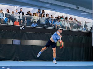 UNC graduate Ryan Seggerman serves the ball against Harvard at the Cone-Kenfield Tennis Center on Sunday, January 29, 2023. UNC beat Harvard 4-1, winning them a ticket to Chicago.