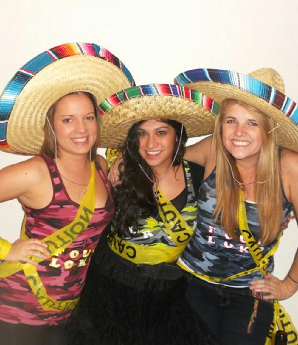 	Ellie Bragg (left), Brianna Nally (center) and Rachel Schwartz (right) celebrate Halloween dressed as the controversial Four Loko alcoholic drink. Courtesy of Ellie Bragg. 