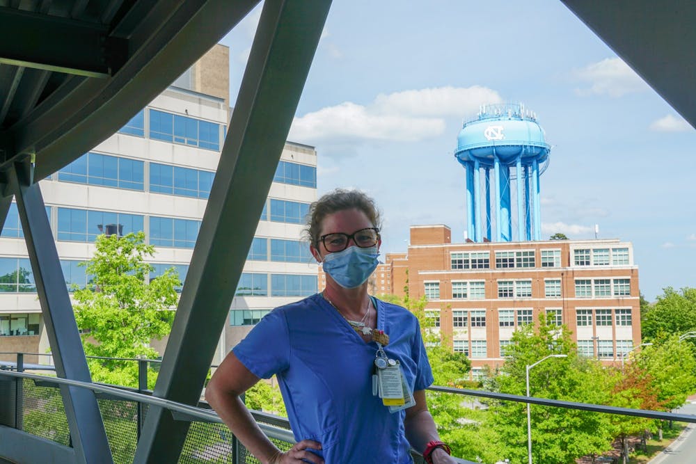 Becky Hoover, RN, BSN, photographed outside of the UNC Cancer Hospital. Hoover has helped combat the pandemic through UNC hospitals.