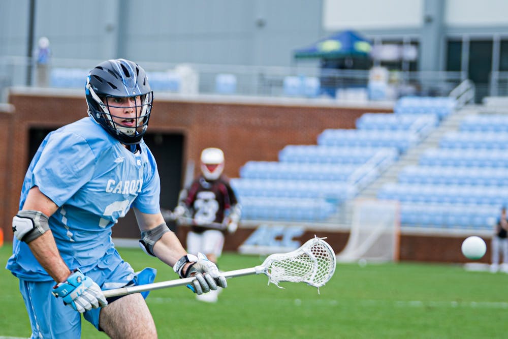Senior defensive midfielder Connor Maher (31) goes after a loose ball during a men's lacrosse game in Dorrance Stadium against Brown University on Wednesday, Feb. 23, 2022. UNC won 14-11.