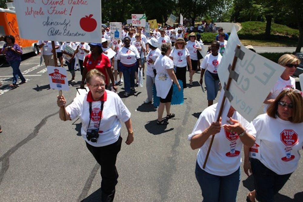 English teacher Diane Leazer marches with a crowd of supporters for K-12 public education funding. DTH/Stephen Mitchell