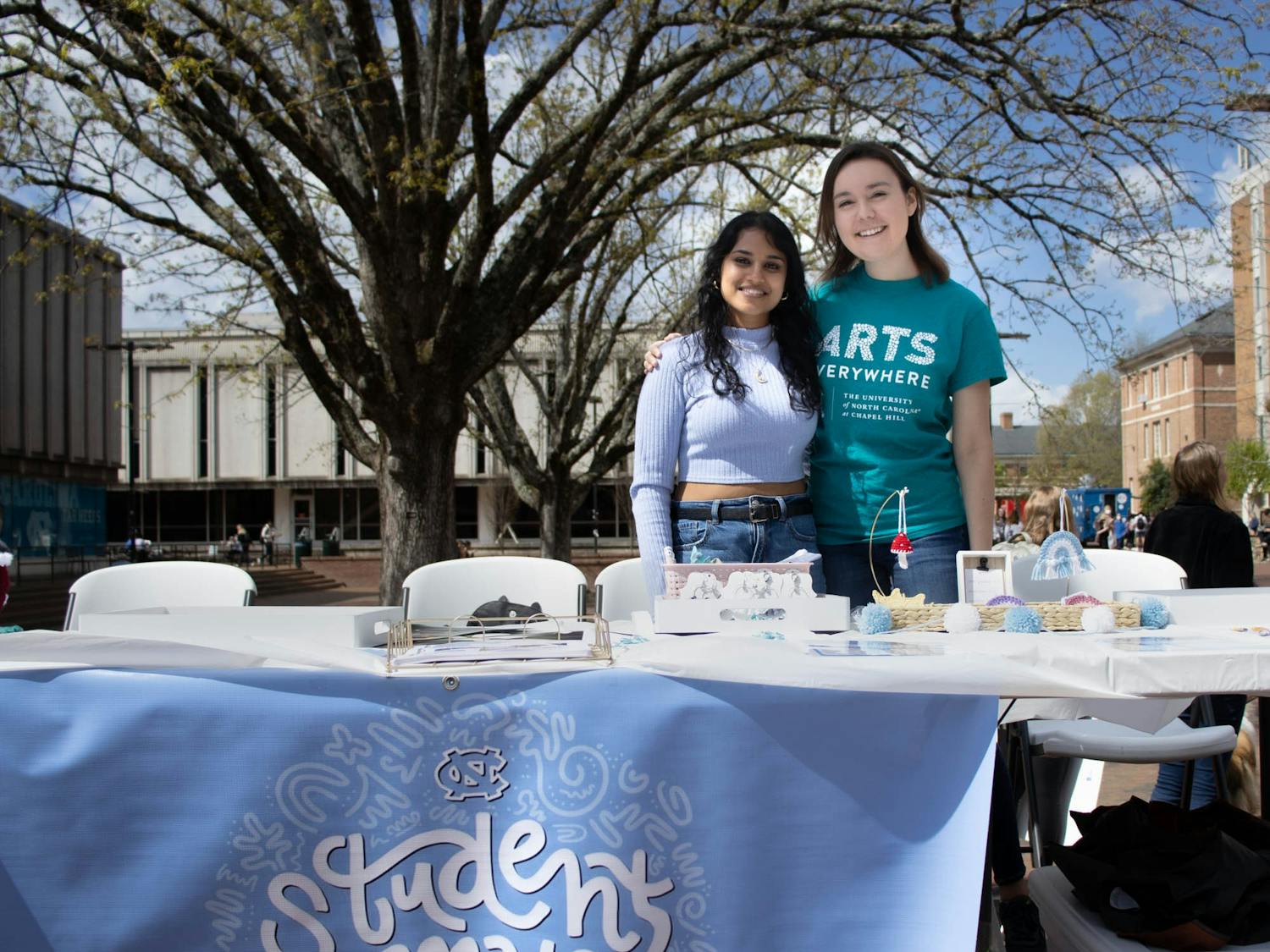 Freshmen Natalie Bradin and Shreya Gundam man the UNC StudentMade Pop Up Shop in the Pit on Arts Everywhere Day on Friday, April 8, 2022.