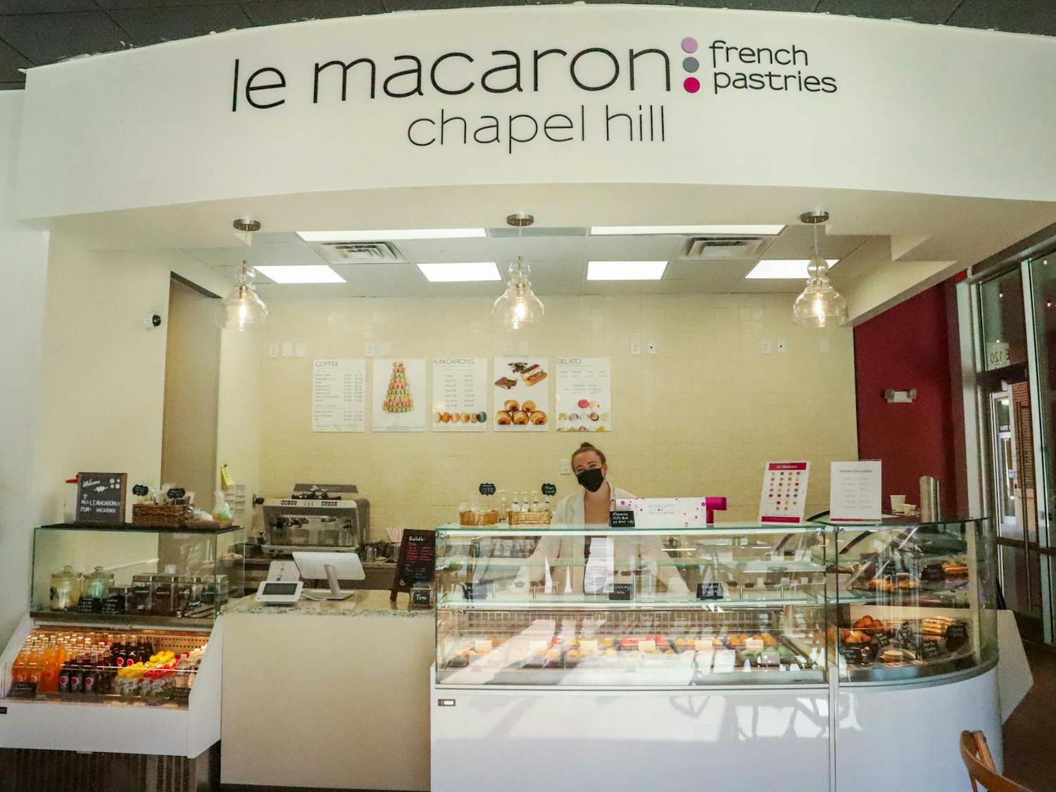 UNC sophomore Ainsley Cogburn works at Le Macaron, a new bakery on Franklin Street, on Thursday, March 3, 2022.