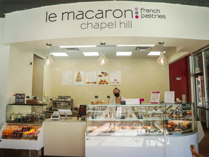 UNC sophomore Ainsley Cogburn works at Le Macaron, a new bakery on Franklin Street, on Thursday, March 3, 2022.