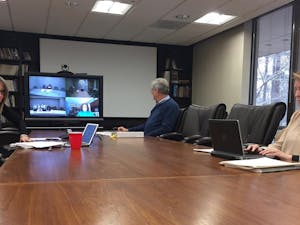 Jayne Grandes, Robert Joyce and Carrie Johnston (L-R) along with other subcommittee members discuss UNC system's policy on sexual harassment and sexual violence via teleconference. The subcommittee is part of the Board of Governor's Campus Security Committee.