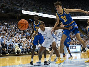 UNC senior forward Armando Bacot (5) fights for the ball during the men's basketball game against Pitt in the Dean Smith Center on Wednesday, Feb. 1, 2023. 