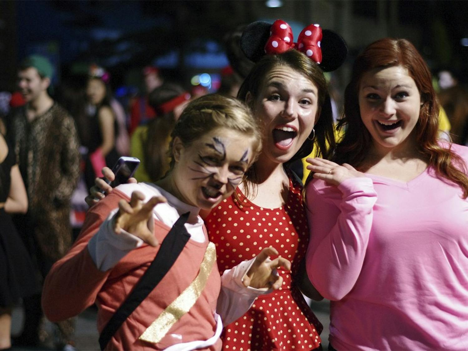 Lily Clark dresses as Tiger Lilly, Maggie Blank dresses as Minnie Mouse, and Shelby Miller  dresses as the imogi girl .