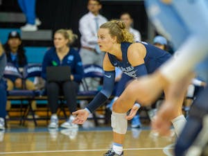 UNC first-year libero Maddy May (25) prepares to receive the serve during the game against Florida State on Sunday, Oct. 2, 2022.