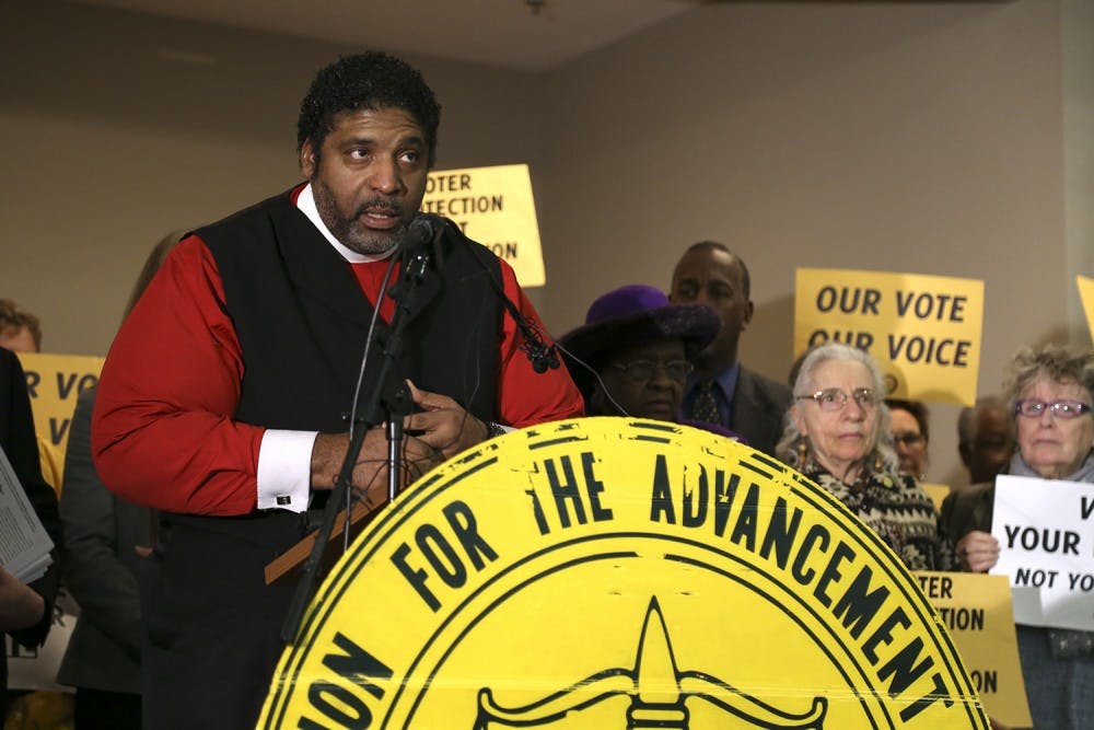 NAACP board member Rev. Dr. William Barber addresses the press at the conference in Martin Street Baptist Church in Raleigh on Tuesday. NC NAACP and Democracy NC joined with faith leaders to discuss a mass voter engagement campaign.