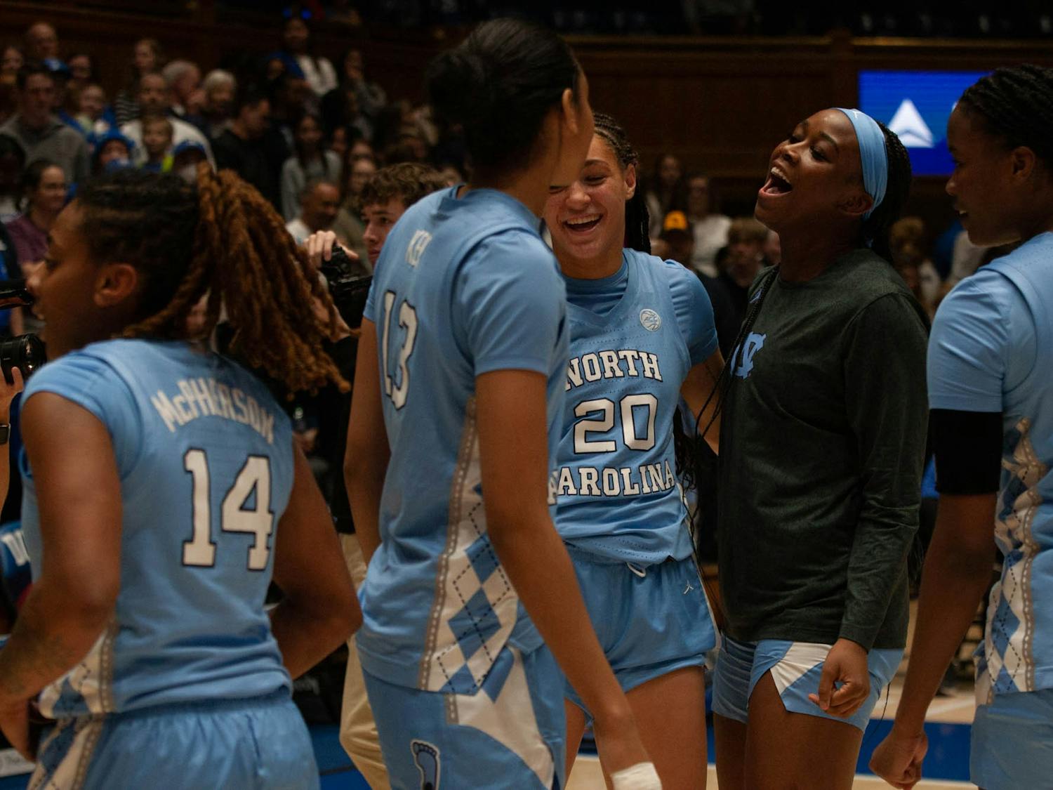 UNC women's basketball players celebrate during the women’s basketball game against Duke on Sunday, Feb. 26, 2023, at Cameron Indoor Stadium. UNC defeated Duke 45-41.