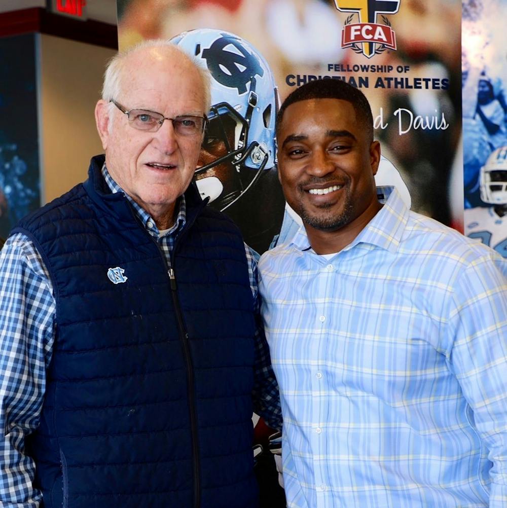 Albert Long (left), a legendary four-sport letter winner and UNC alumnus, with UNC football’s chaplain Mitch Mason (right). Photo courtesy of Mitch Mason.