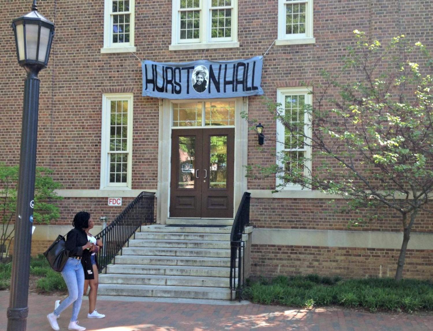 Student activists placed a banner reading "Hurston Hall" over the name&nbsp;plaque of Saunders Hall Friday, April 24, 2015. It has since been renamed "Carolina Hall."