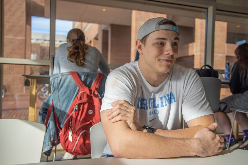 Junior exercise and sports science major Cody Woolverton sits near Alpine Bagel Cafe in the Student Union. Woolverton transferred to UNC this past semester from Vance-Granville Community College in Henderson, N.C.