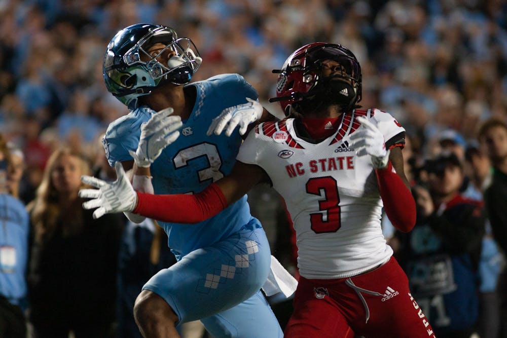 UNC senior wide receiver, Antoine Green (3), looks for the ball in Kenan Stadium on Nov. 25, 2022, as the Tar Heels face off against the NC State Wolfpack. UNC lost 30-27 in overtime.