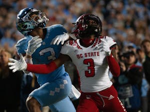 UNC senior wide receiver, Antoine Green (3), looks for the ball in Kenan Stadium on Nov. 25, 2022, as the Tar Heels face off against the NC State Wolfpack. UNC lost 30-27 in overtime.