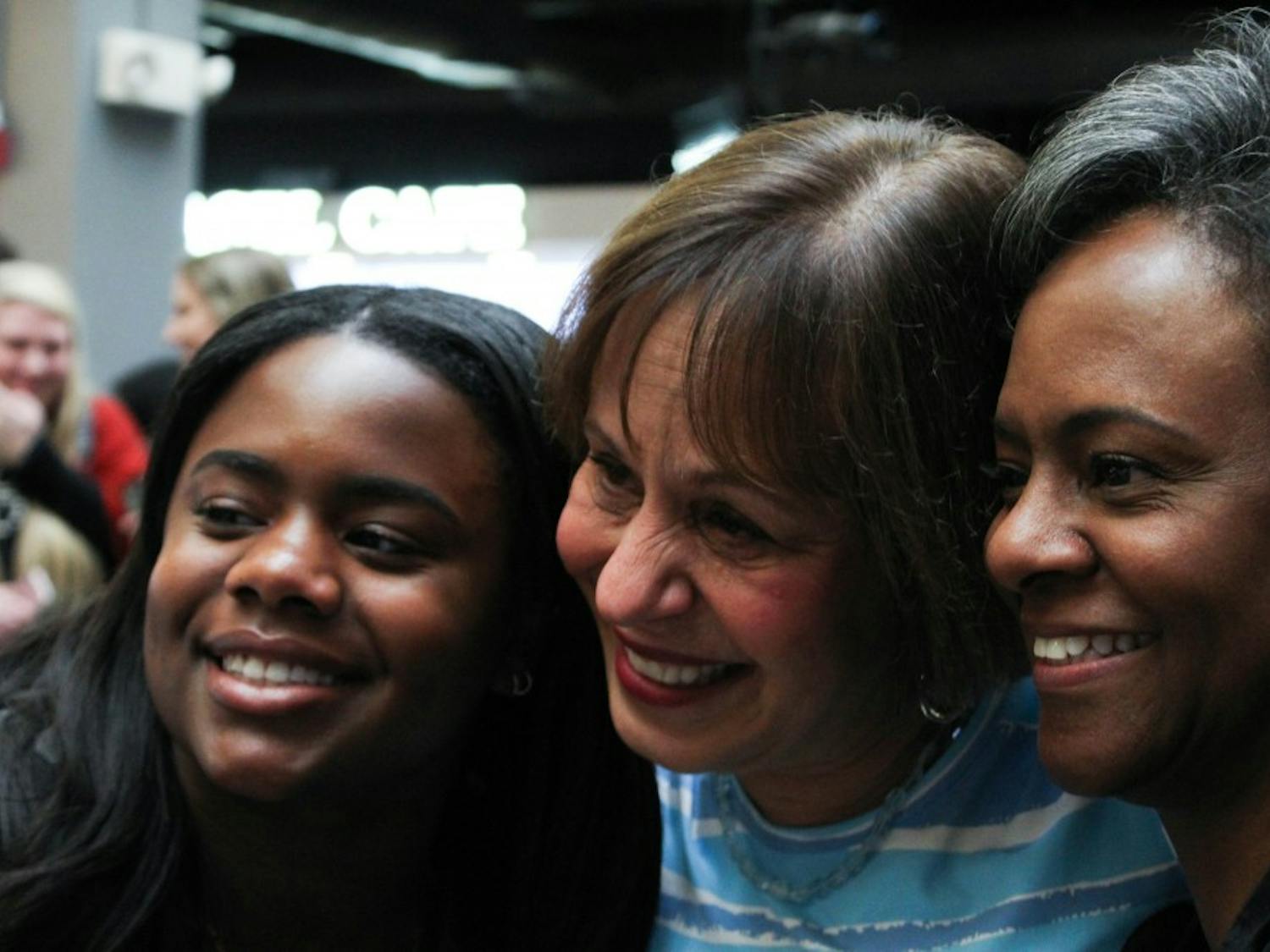 Chancellor Carol Folt taking a selfie with first-year Alexandra Mauney, exercise and sports science major and daughter of vice-chancellor Felicia Washington, and vice-chancellor Felicia Washington at "Thank you, Carolina" on Tuesday, Jan. 29, 2019, in the Carolina Union. Mauney says that it "breaks her heart" that Folt is leaving, but that it is "good to know that Folt is leaving with a lasting impact on the Carolina community."