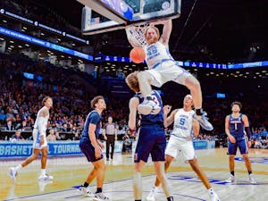 Graduate transfer forward Brady Manek (35) dunks the ball during the quarterfinals of the ACC tournament against Virginia at the Barclays Center in Brooklyn on March 10, 2022. UNC will advance to the semifinals of the tournament after beating Virginia 63-43.