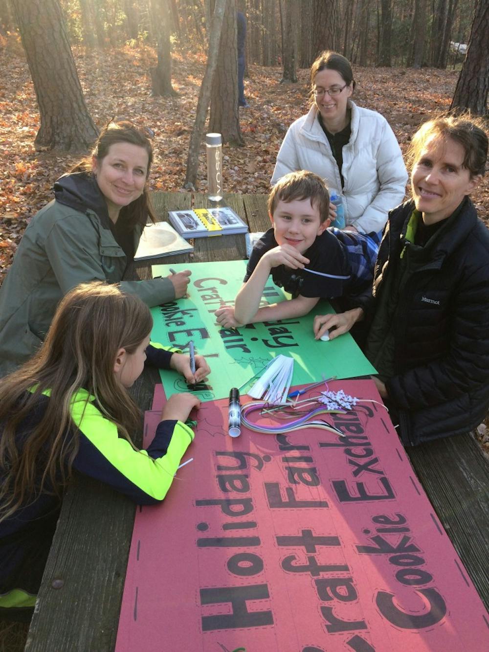 Homeschooling parents and children decorated a sign for December's Holiday Craft Fair and Cookie Exchange. Photo courtesy of Emily Brewer.