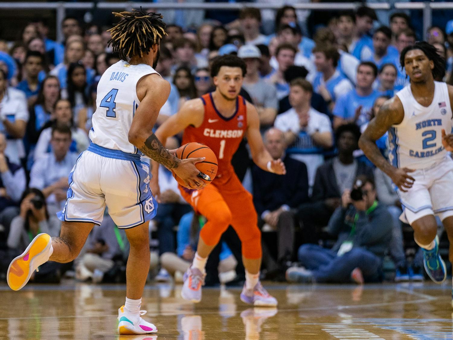 UNC junior guard RJ Davis (4) looks to hand the ball off to junior guard Caleb Love (2) during the men’s basketball game against Clemson on Saturday, Feb. 11, 2023, at the Dean E. Smith Center. UNC beat Clemson 91-71.