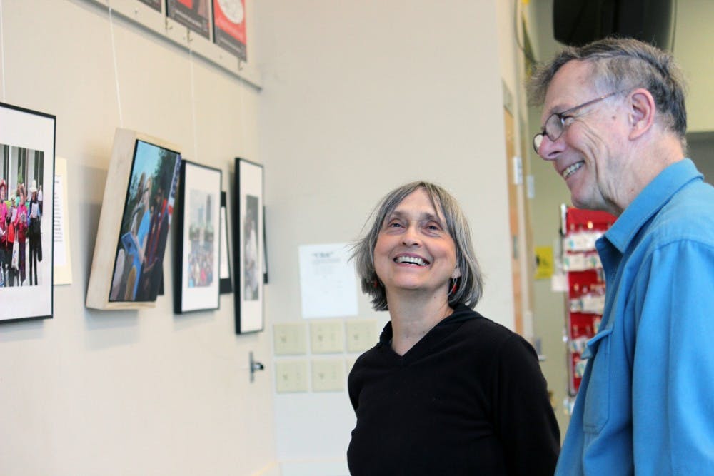 Suzanne Lamport and one of the artists Dave Otto enjoy browsing the exhibition.  The activist exhibition of artist David Taylor, Harry Phillips, and photographer Dave Otto is called "Images of Moral Mondays", which displays artwork of the ongoing speeches and protests of major issues, including unemployment, voting rights, health care, education, and many more. 