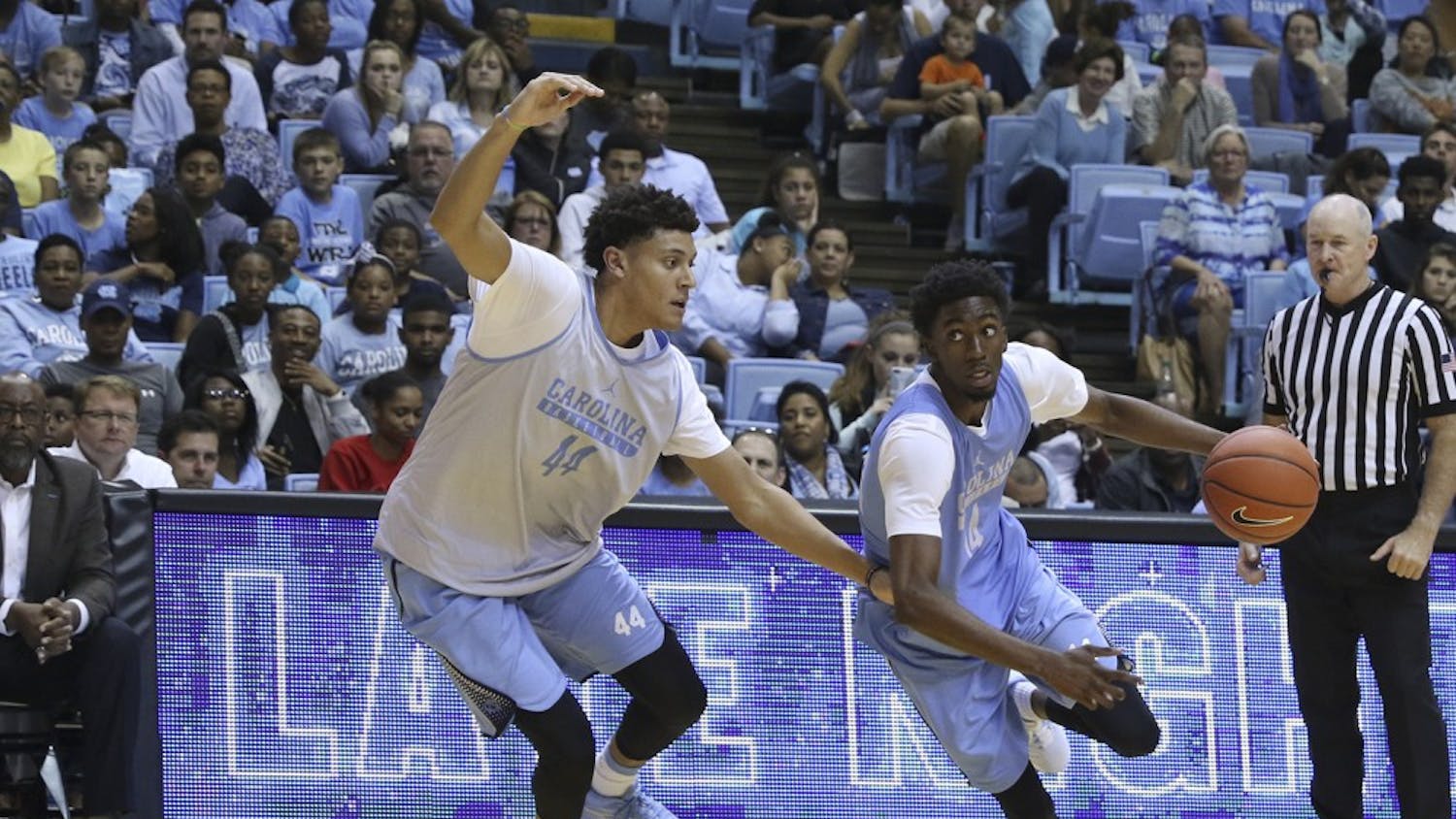UNC first-year&nbsp;Brandon Robinson (14) drives towards the basket while being guarded by junior guard Justin Jackson (44) on Friday at Late Night with Roy.